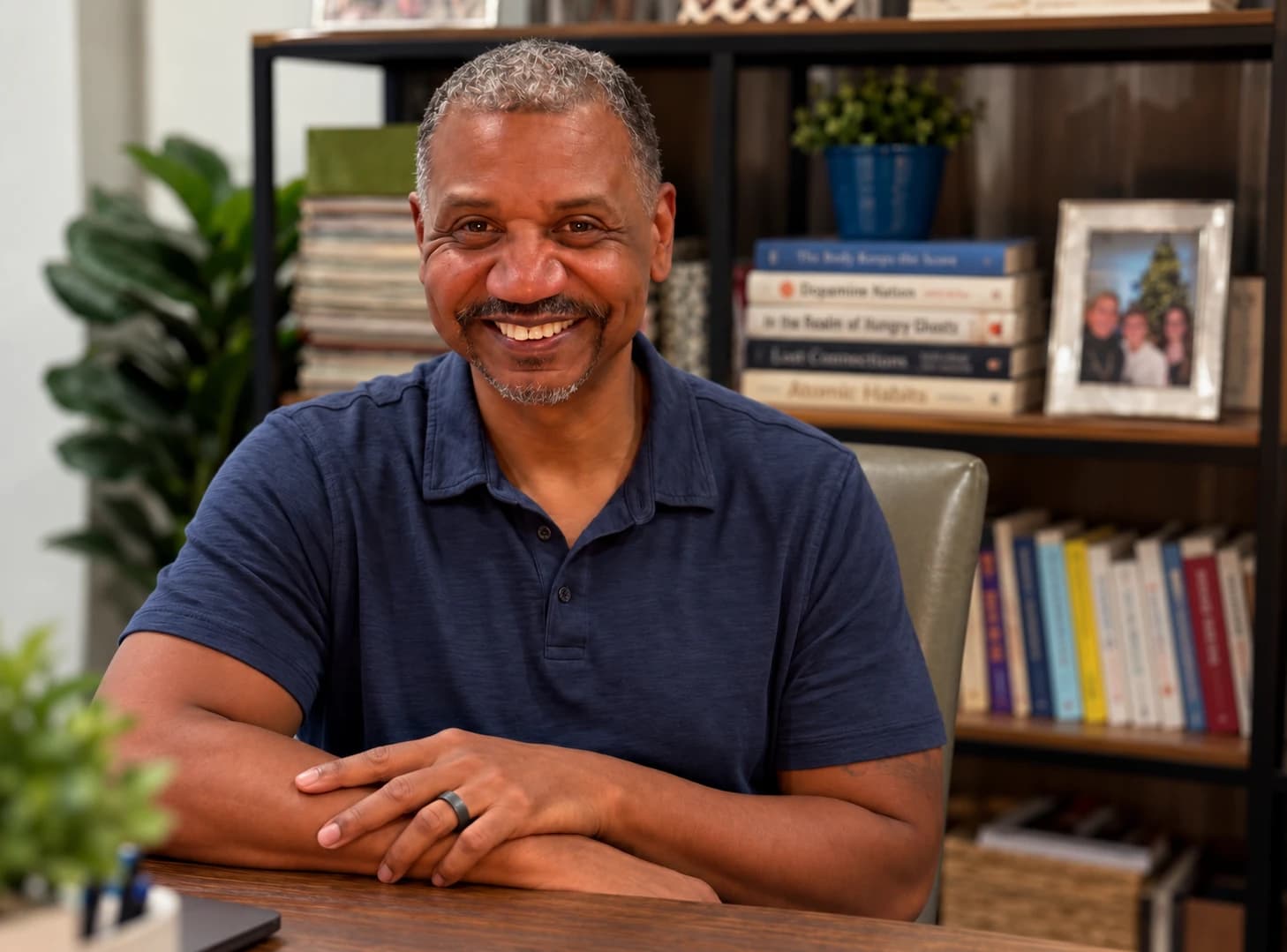 Tony Lyda, co-founder of Jenora, seated at a desk and smiling.